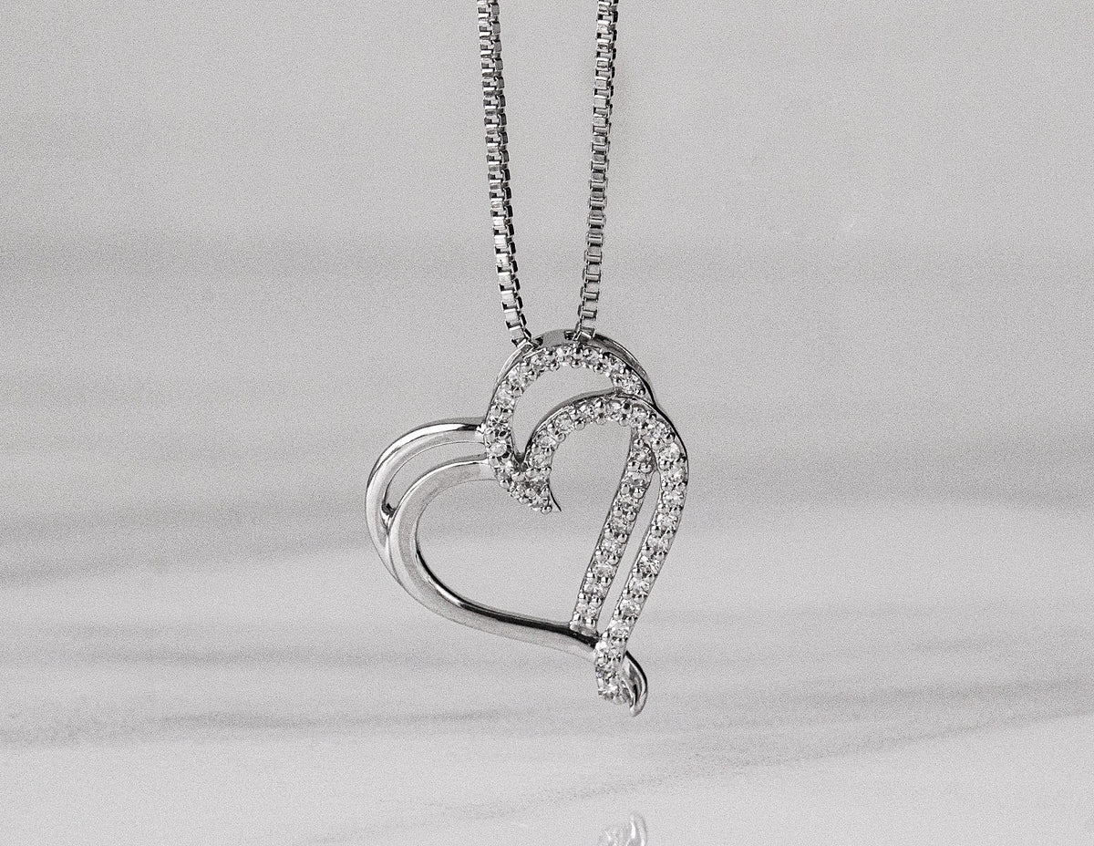 1/10ct. t.w. Diamond Heart Pendant in Sterling Silver