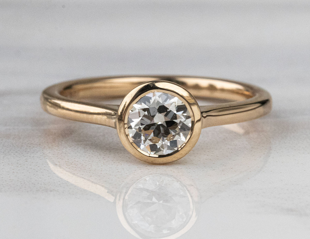 3/4ct. Round Cut Newborn Lab Created Diamond Bezel Engagement Ring in 14K Yellow Gold
