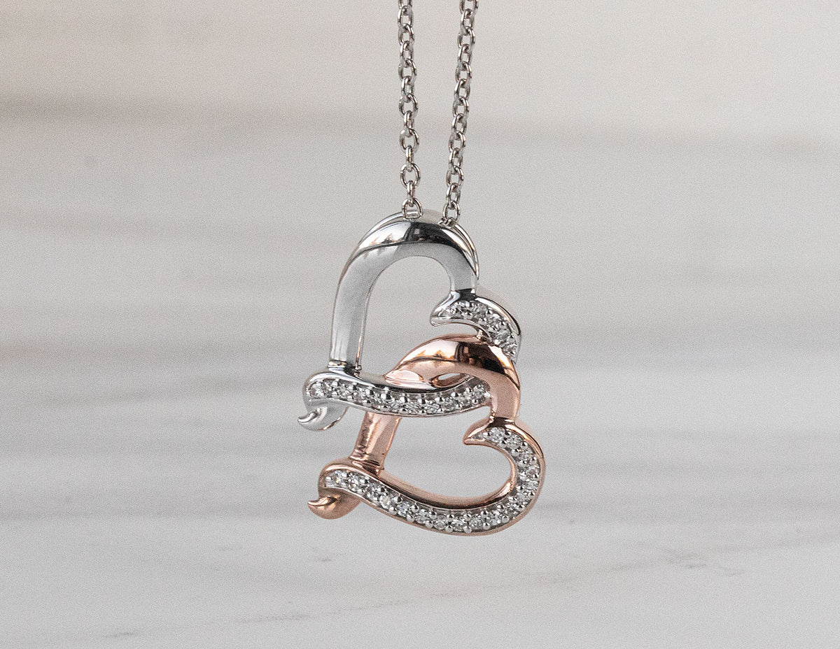 1/10ct. t.w. Diamond Pendant in Sterling Silver and 10K Rose Gold