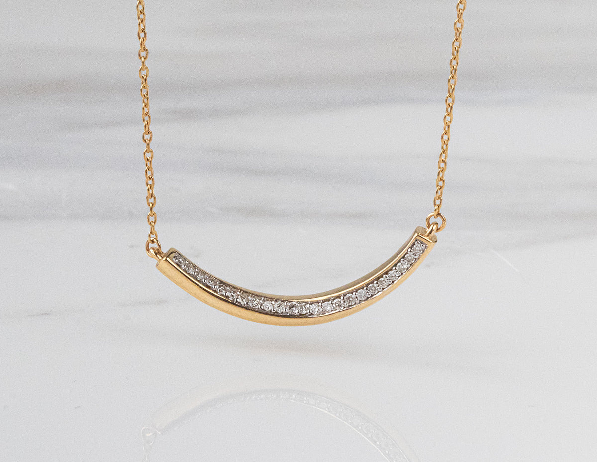 1/10ct. t.w. Diamond Curved Bar Pendant in 14K Yellow Gold