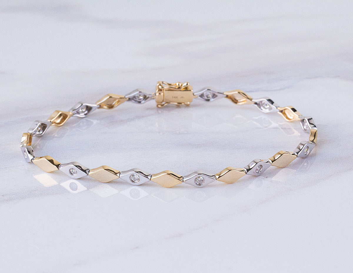 1/3ct. t.w. Diamond Fashion Bracelet in 14K Yellow and White Gold