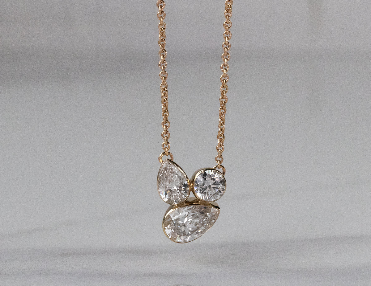 1 1/10ct. t.w. Pear and Round Cut Newborn Lab Created Diamond Fashion Pendant in 14K Yellow Gold