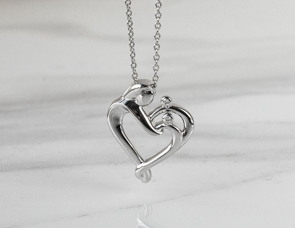.02ct. t.w. Mom and Children Diamond Pendant in Sterling Silver