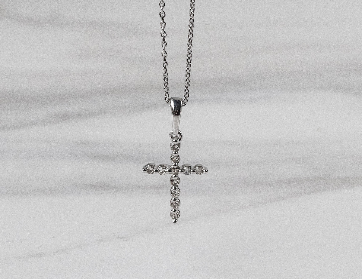 1/10ct. t.w. Diamond Cross Pendant in Sterling Silver