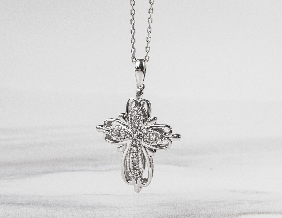 .05ct. t.w. Diamond Cross Pendant in Sterling Silver