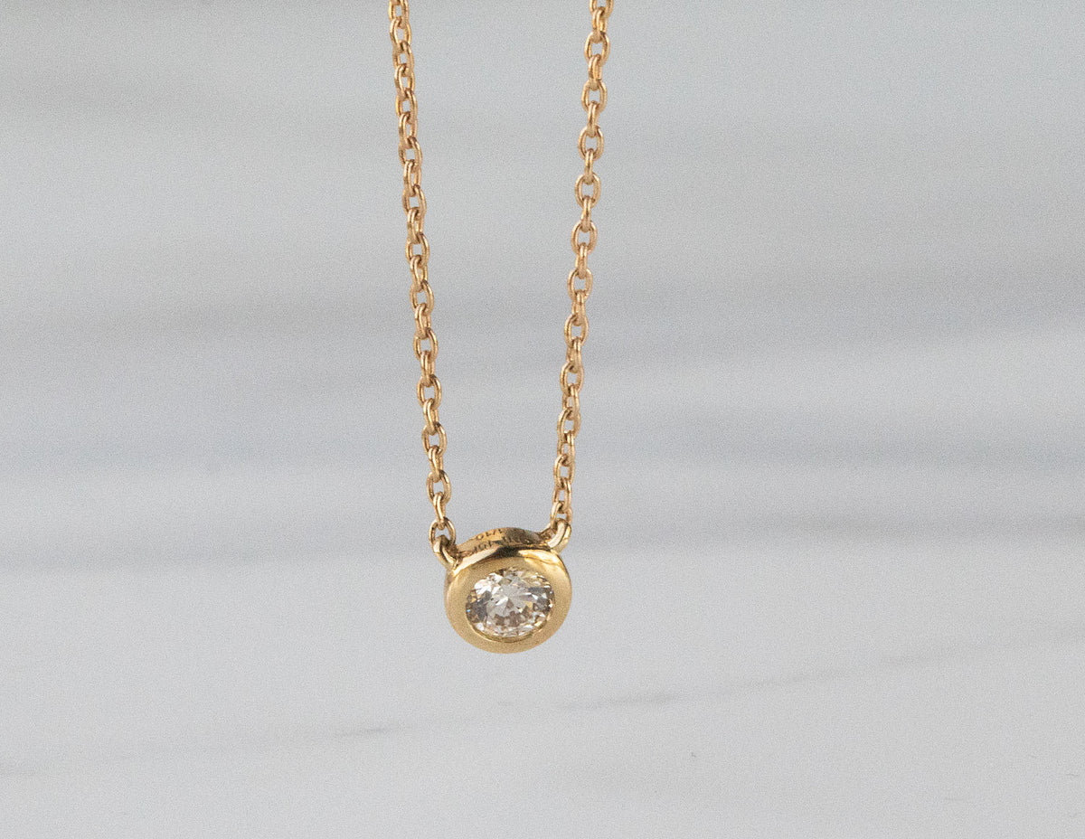 1/10ct. Diamond Bezel Pendant in 10K Yellow Gold