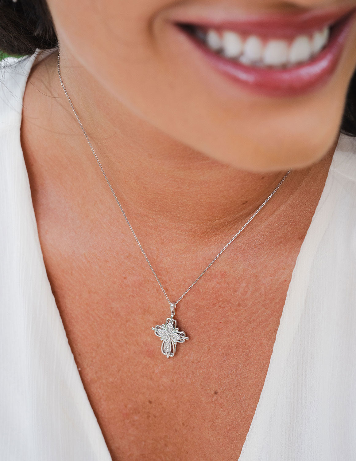 .05ct. t.w. Diamond Cross Pendant in Sterling Silver