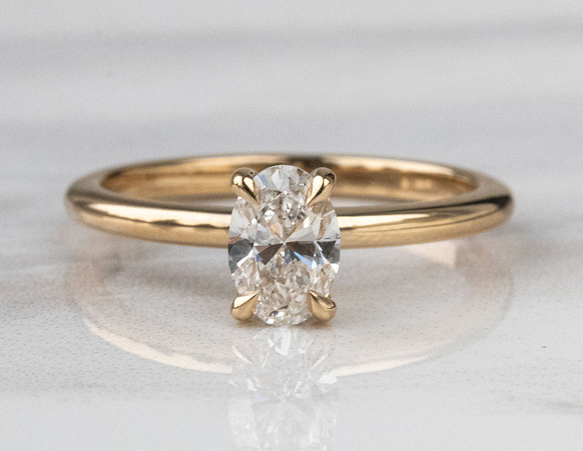3/4ct. t.w. Oval Cut Newborn Lab Created Diamond Hidden Halo Engagement Ring in 14K Yellow Gold