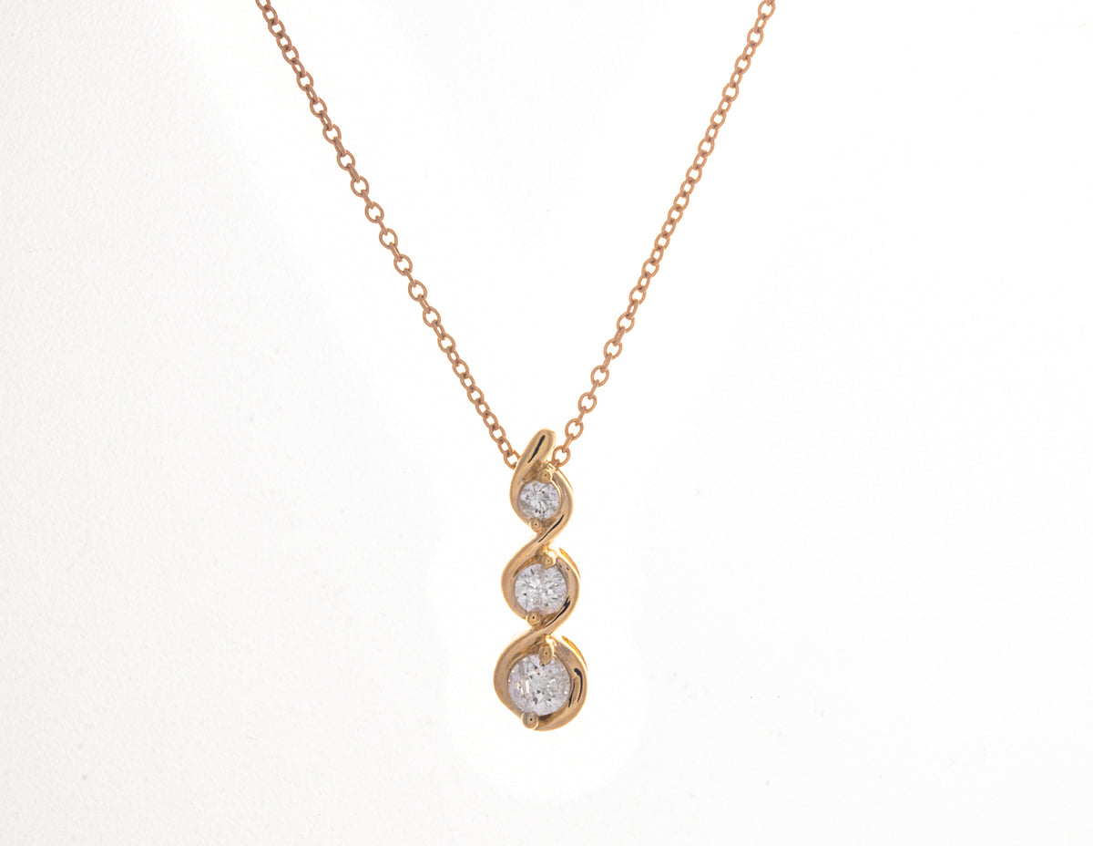 1/5ct. t.w. 3-Stone Diamond Infinity Pendant in 10K Yellow Gold
