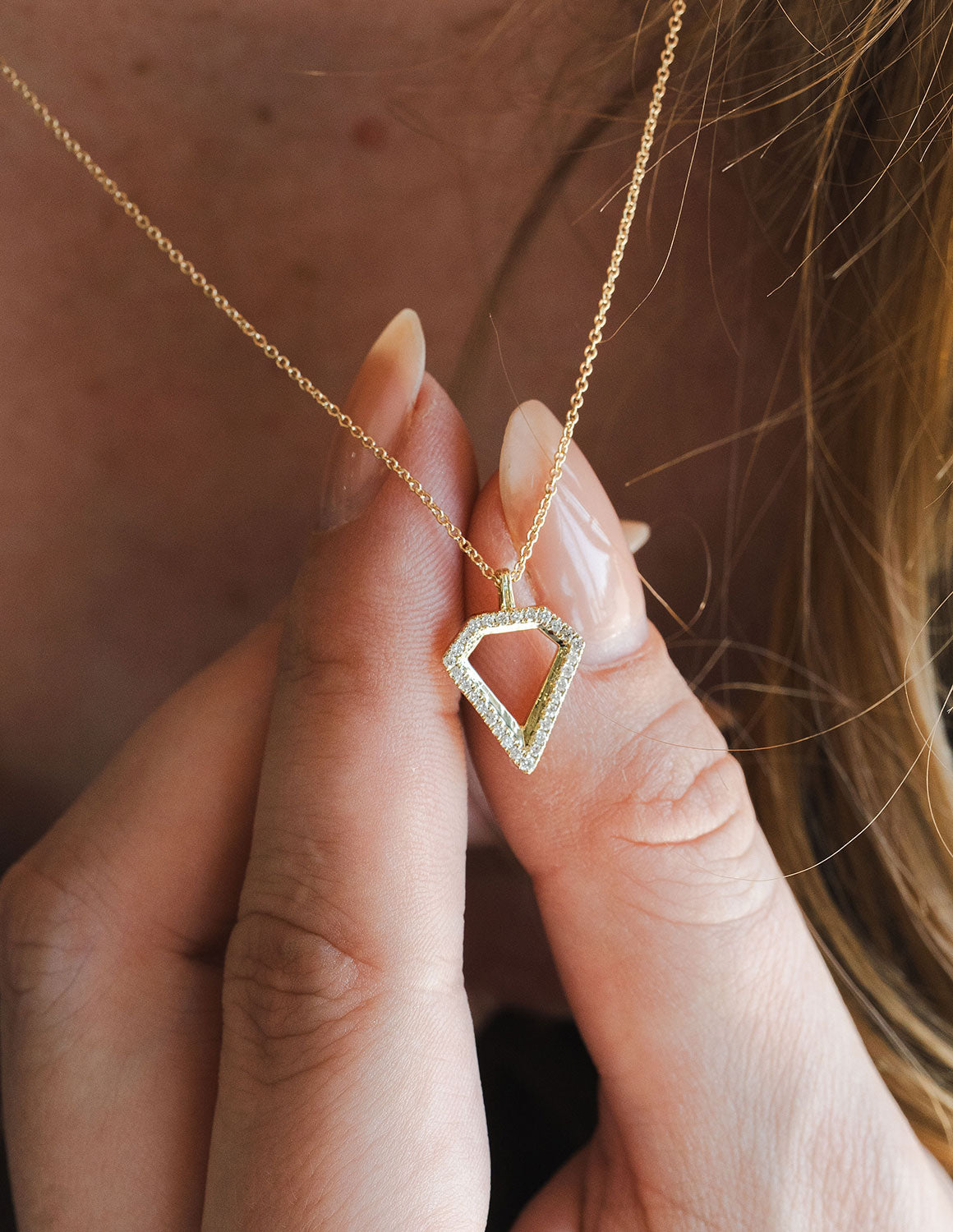 1/8ct. t.w. Diamond Pendant in 10K Yellow Gold