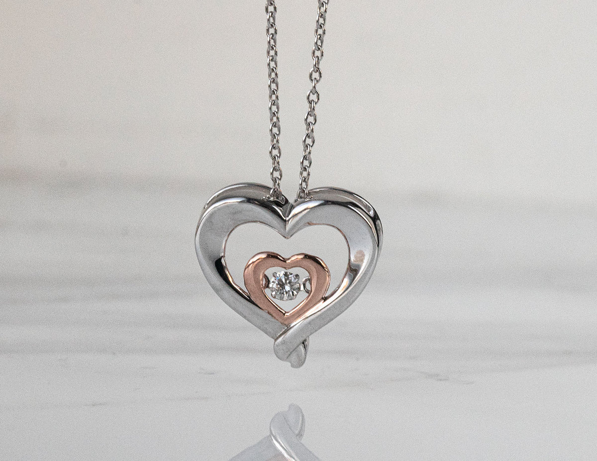 1/14ct. Diamond Dancing Hearts Pendant in Sterling Silver and 10K Rose Gold