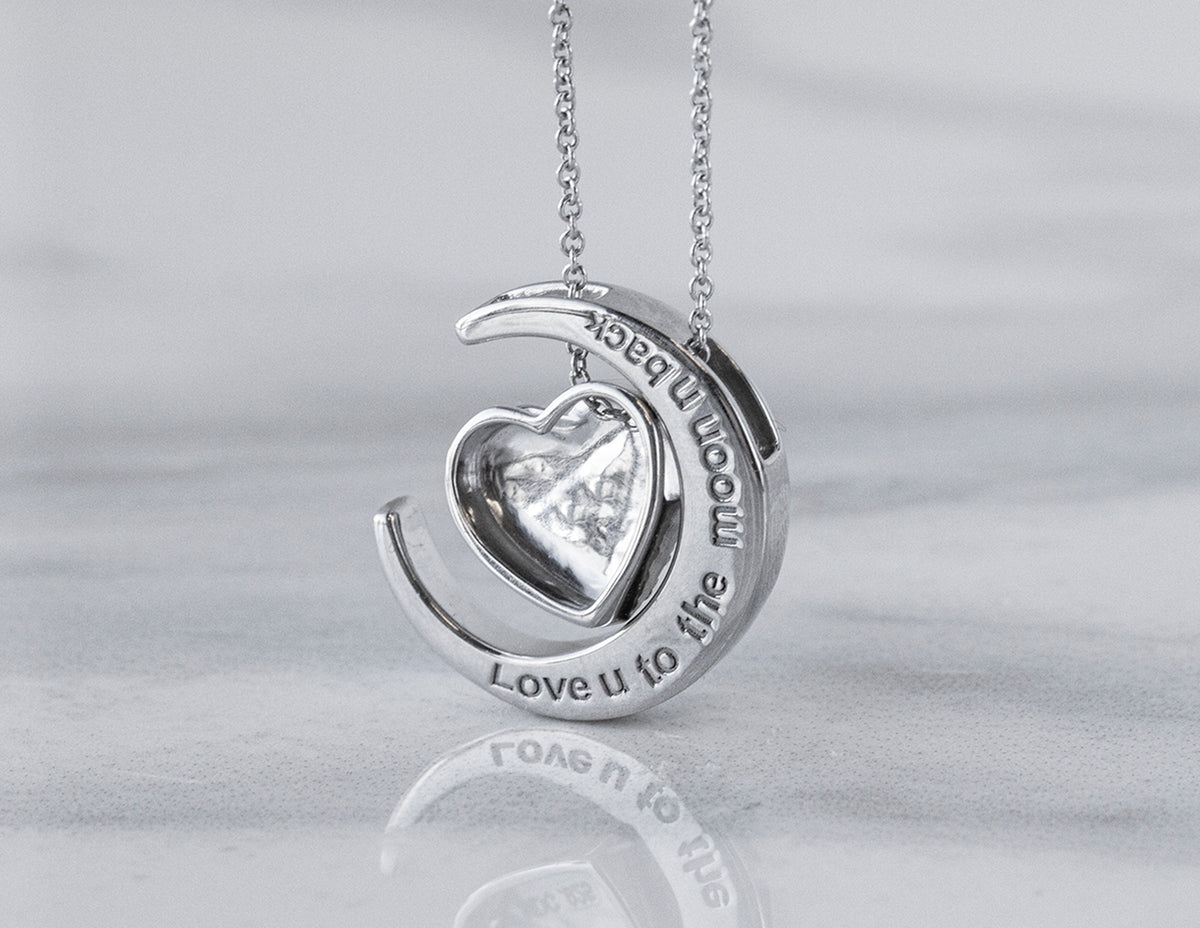 1/8ct. t.w. Diamond 'Love U to the moon & back' Pendant in Sterling Silver