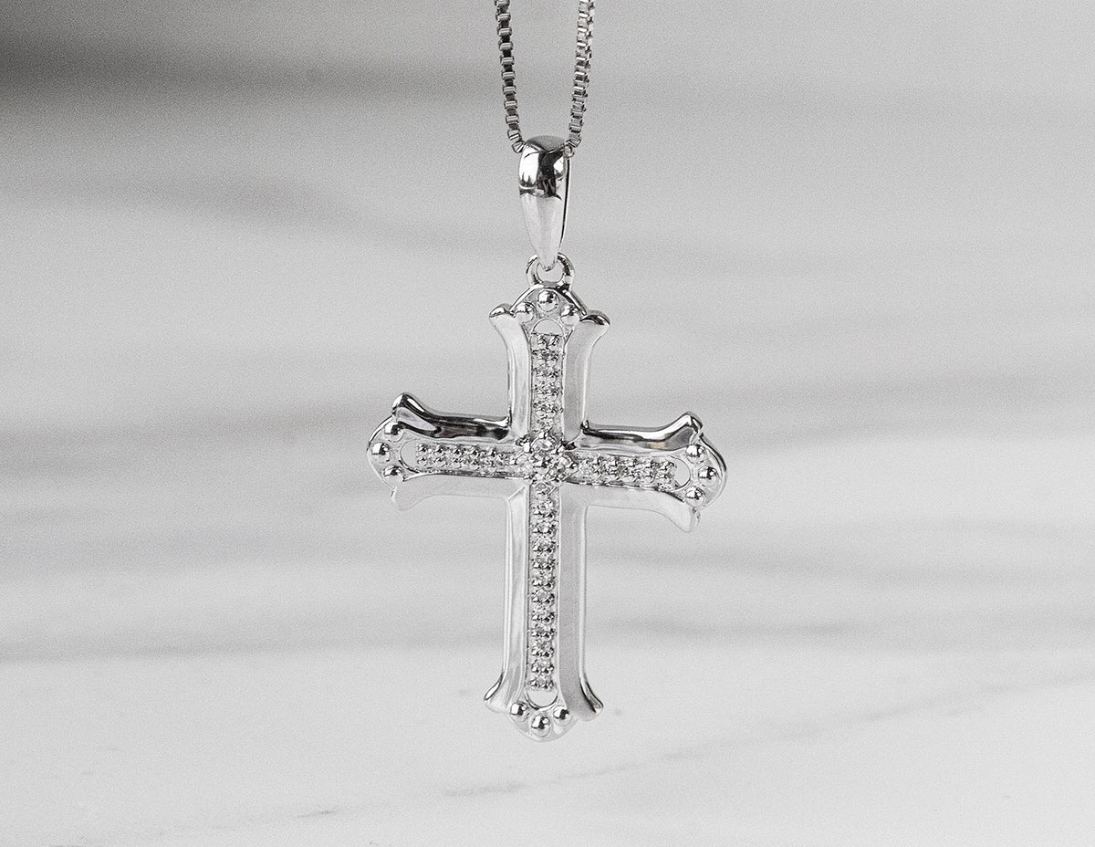1/10ct. t.w. Diamond Cross Pendant in Sterling Silver