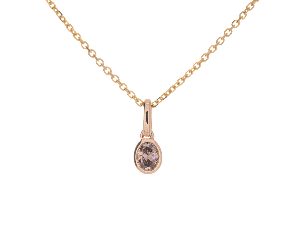 1/7ct. Brown Oval Cut Bezel Set Diamond Pendant in 14K Yellow Gold