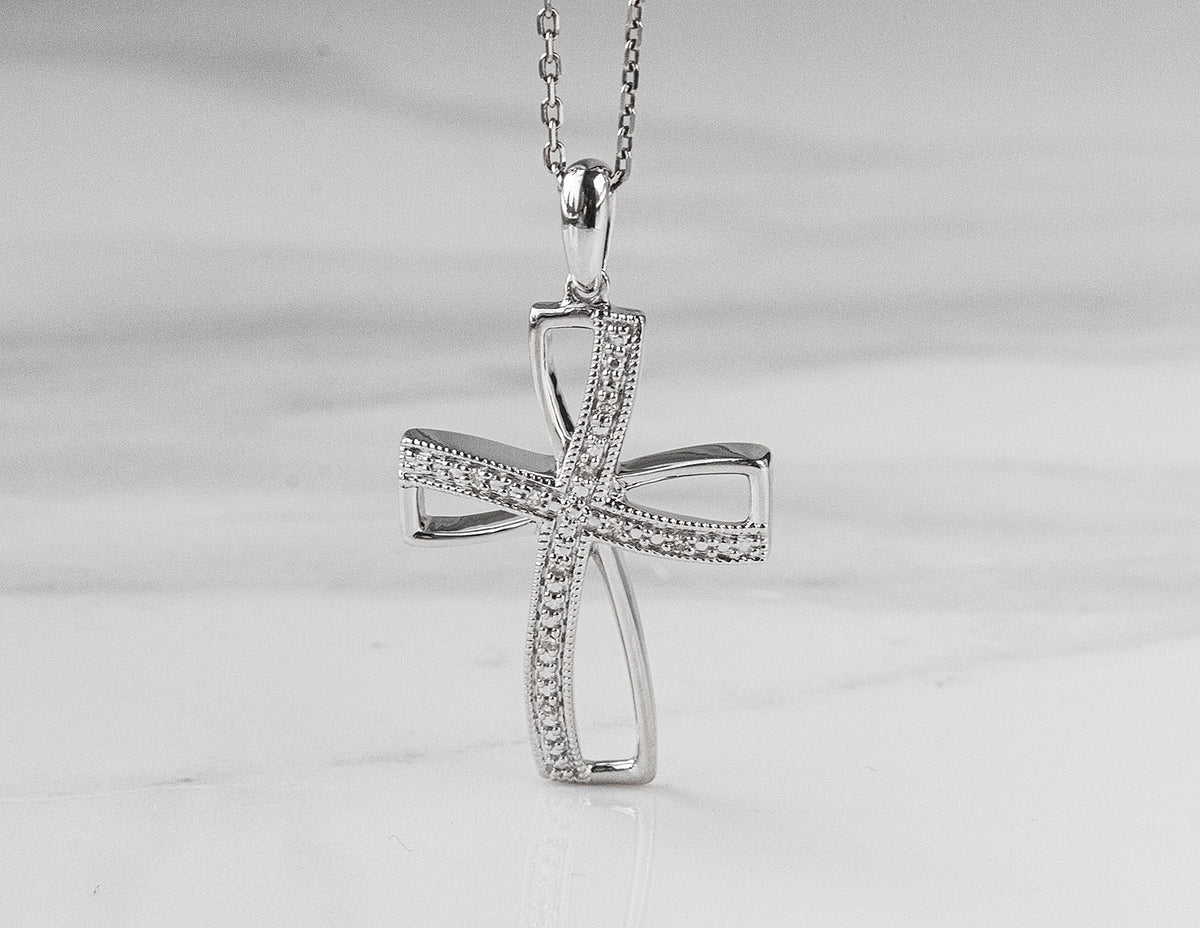 .03ct. t.w. Diamond Cross Pendant in Sterling Silver