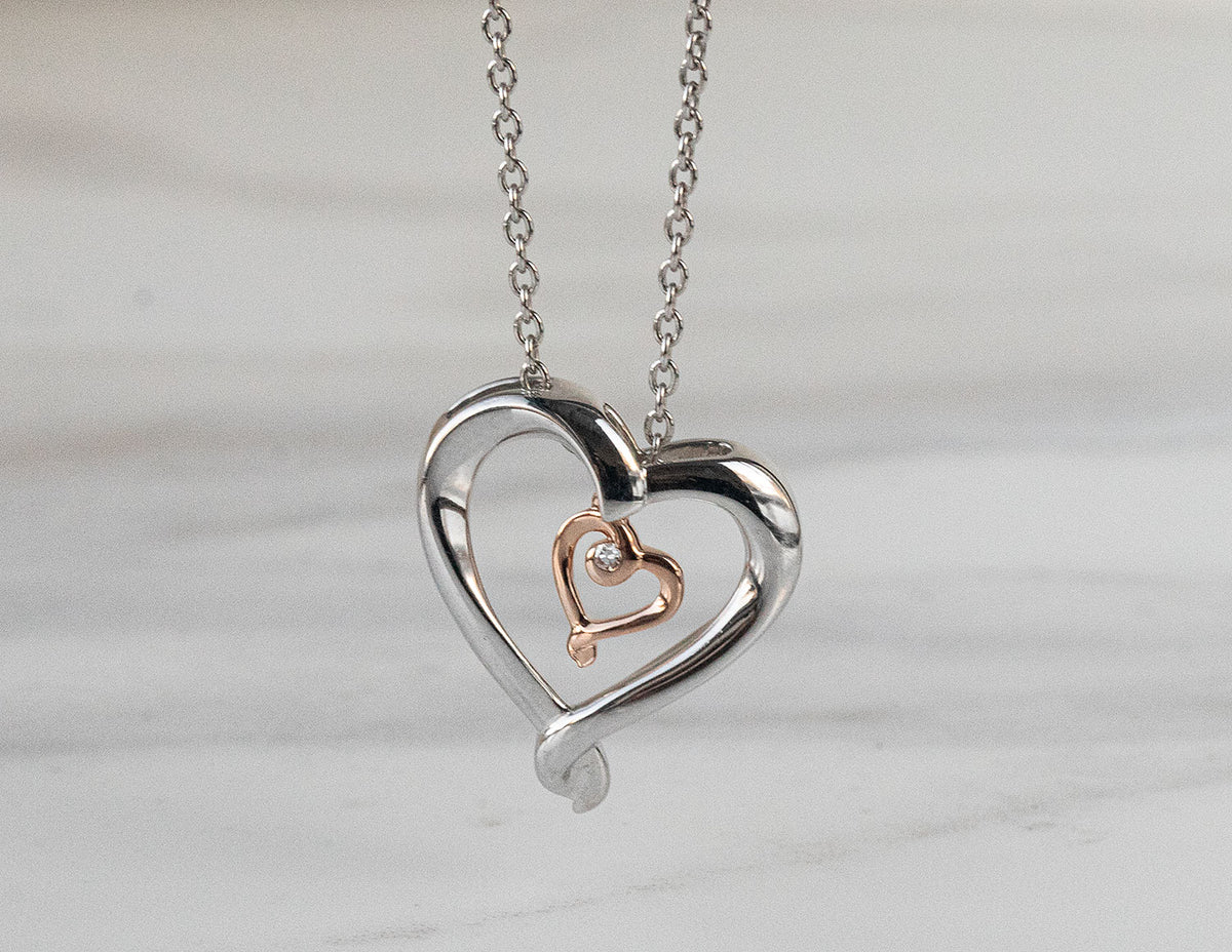 .01ct. Diamond Pendant in Sterling Silver and 10K Rose Gold