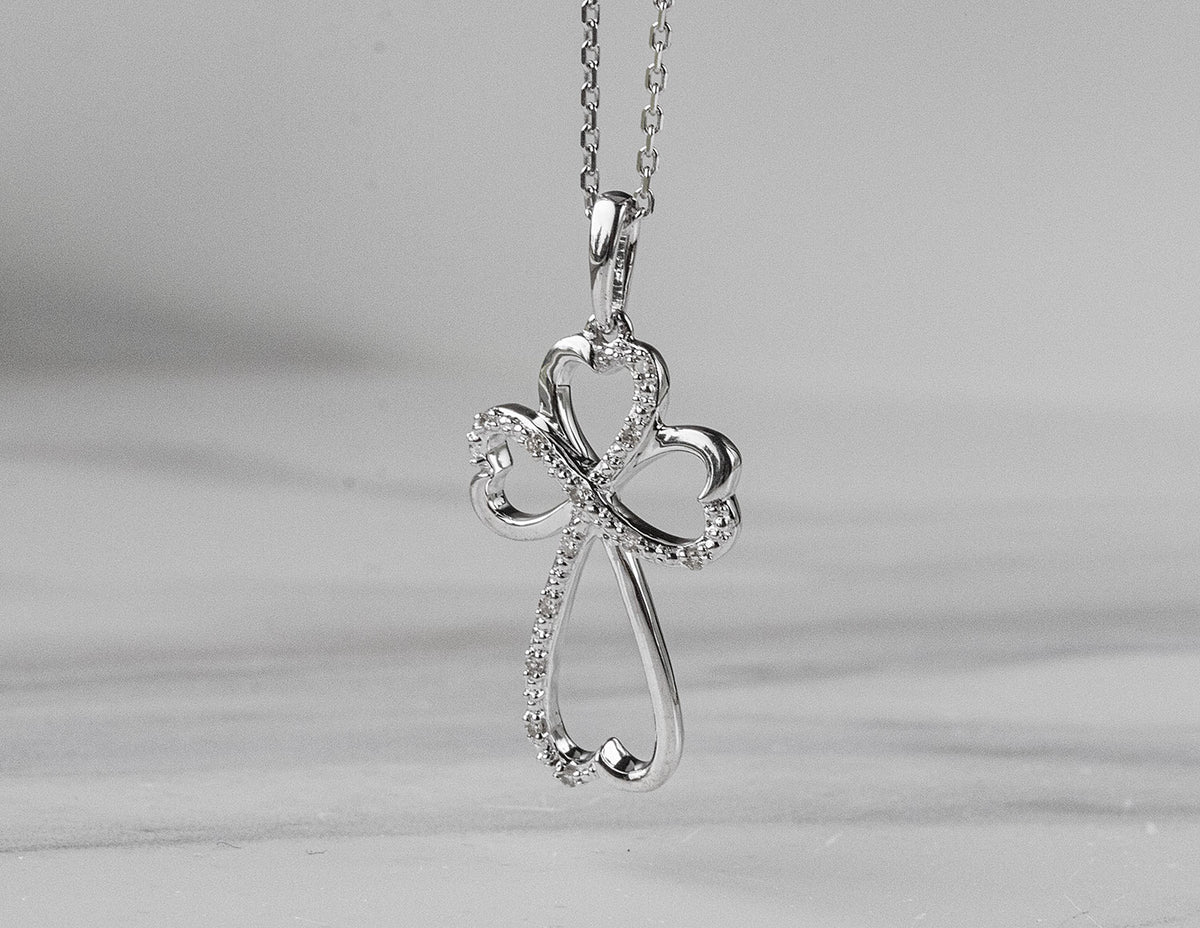 .05ct. t.w. Diamond Cross Pendant in Sterling Silver