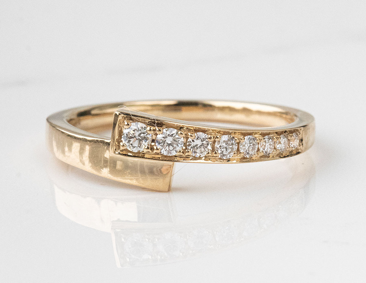 1/6ct. t.w. Diamond Bypass Ring in 14K Yellow Gold