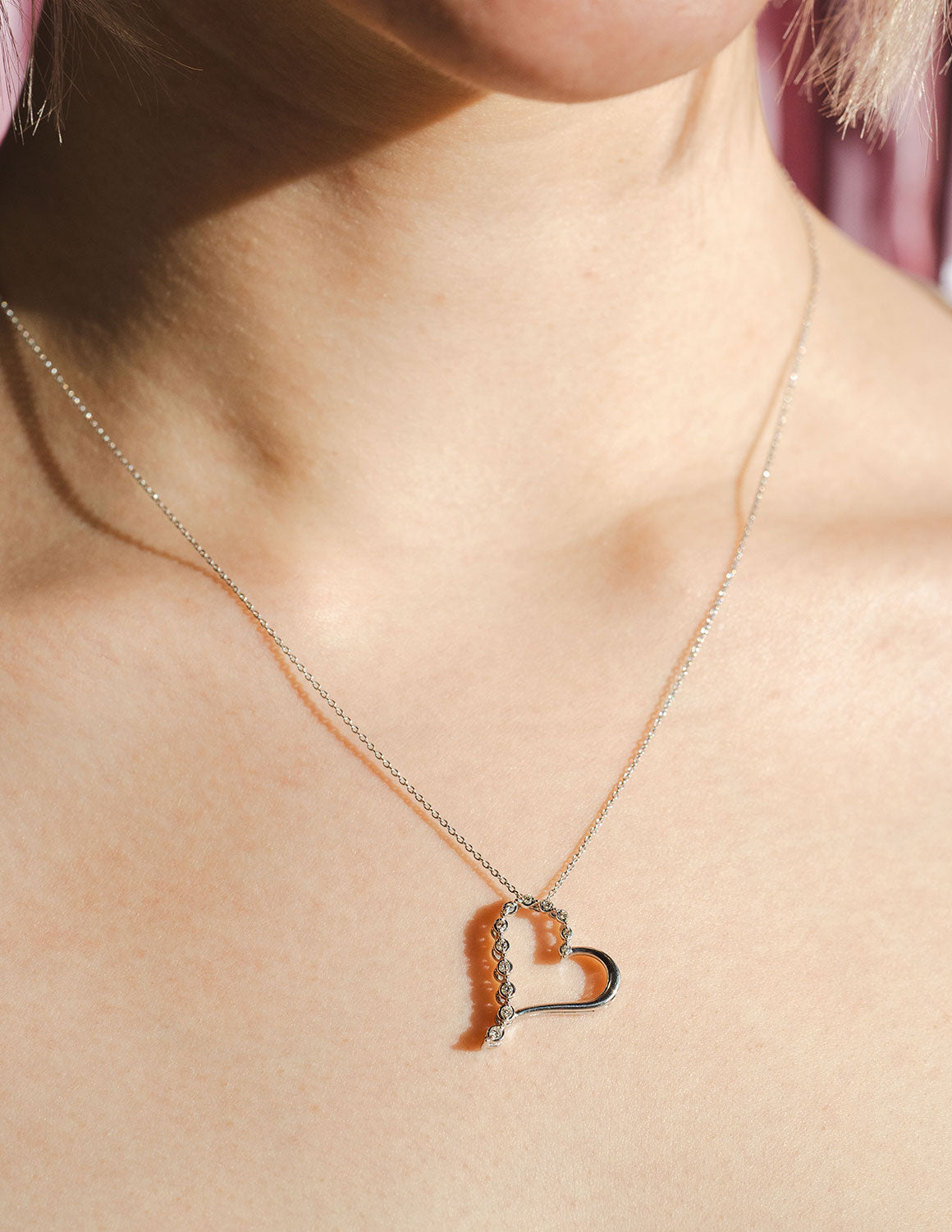 1/10ct. t.w. Diamond Journey Heart Pendant in Sterling Silver