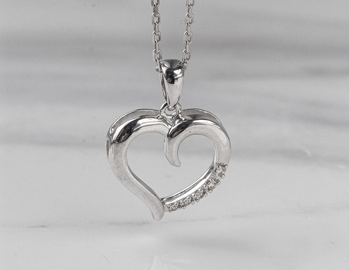 .03ct. t.w. Diamond Journey Heart Pendant in Sterling Silver