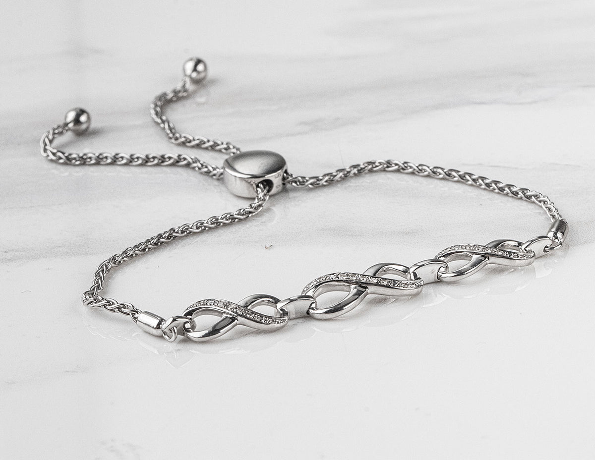 1/14ct. t.w. Diamond Infinity Bracelet in Sterling Silver
1/14ct. t.w. Infinity Bracelet in Sterling Silver