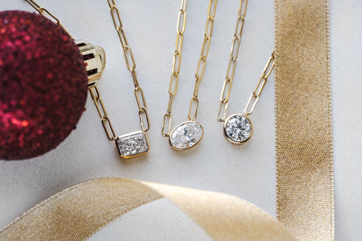 1 1/2ct. Oval Cut Newborn Lab Created Diamond Bezel Pendant in 14K Yellow Gold