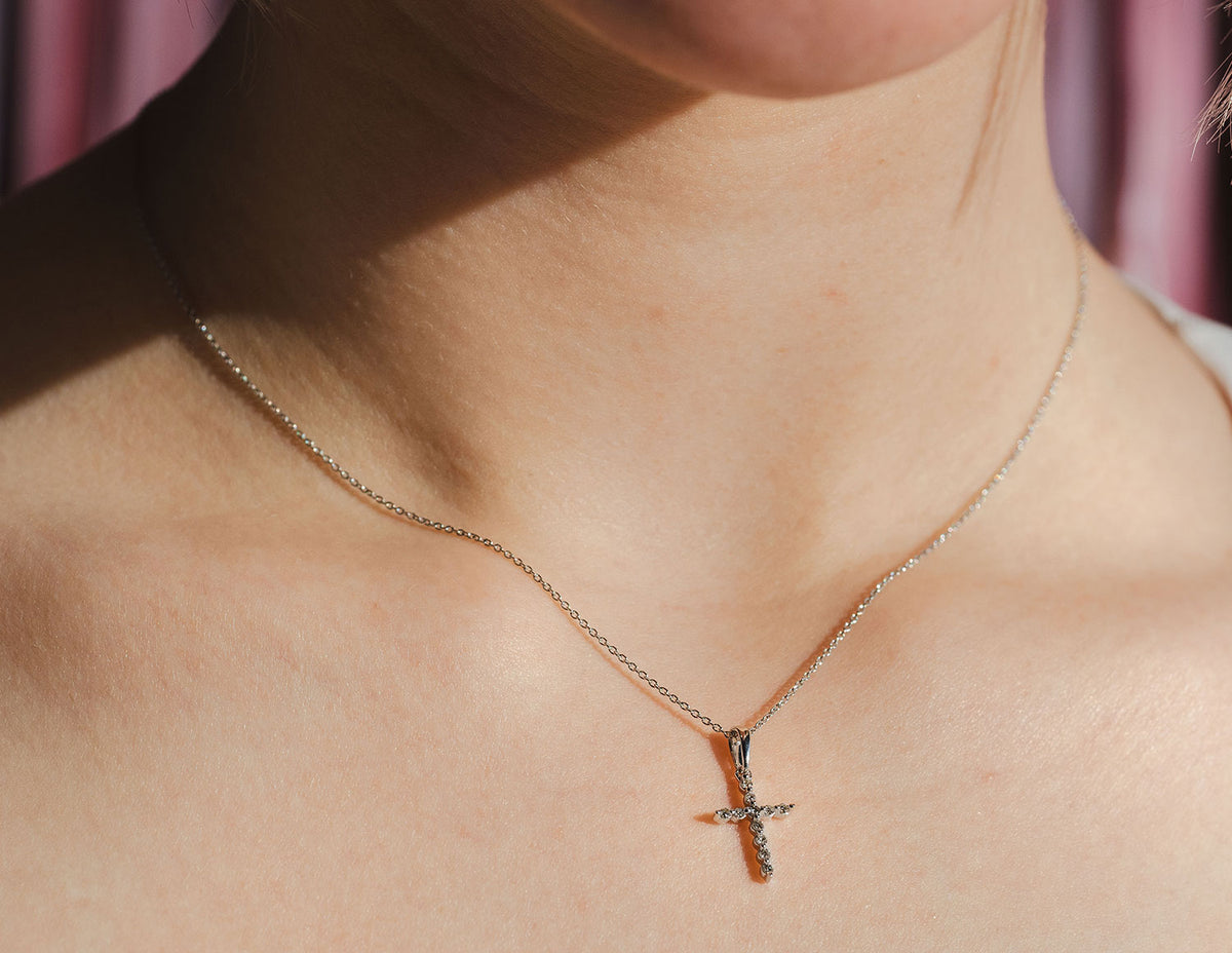 1/10ct. t.w. Diamond Cross Pendant in Sterling Silver