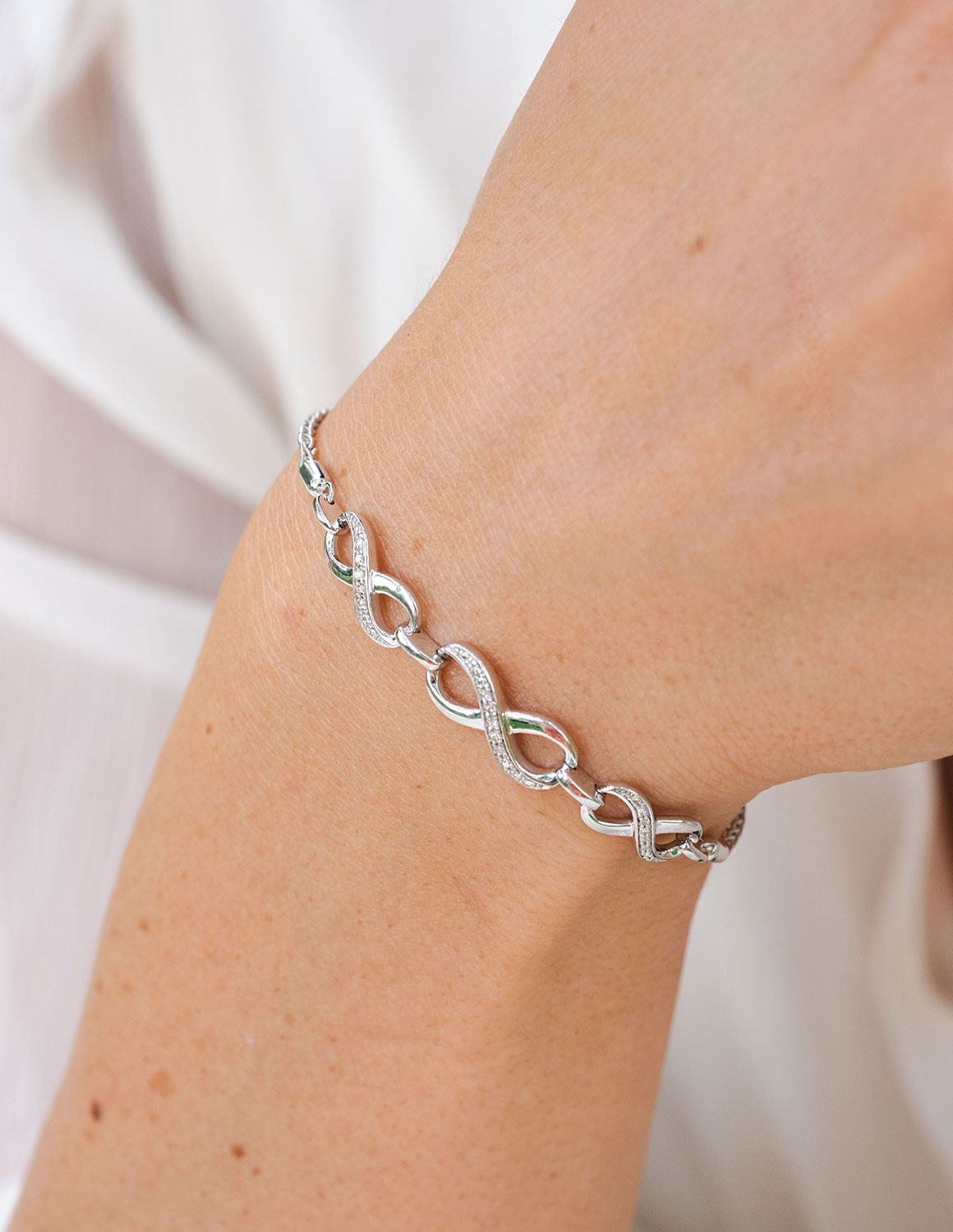 1/14ct. t.w. Diamond Infinity Bracelet in Sterling Silver
1/14ct. t.w. Infinity Bracelet in Sterling Silver