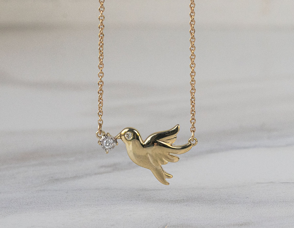 .02ct. t.w. Diamond Dove Pendant in 10K Yellow Gold