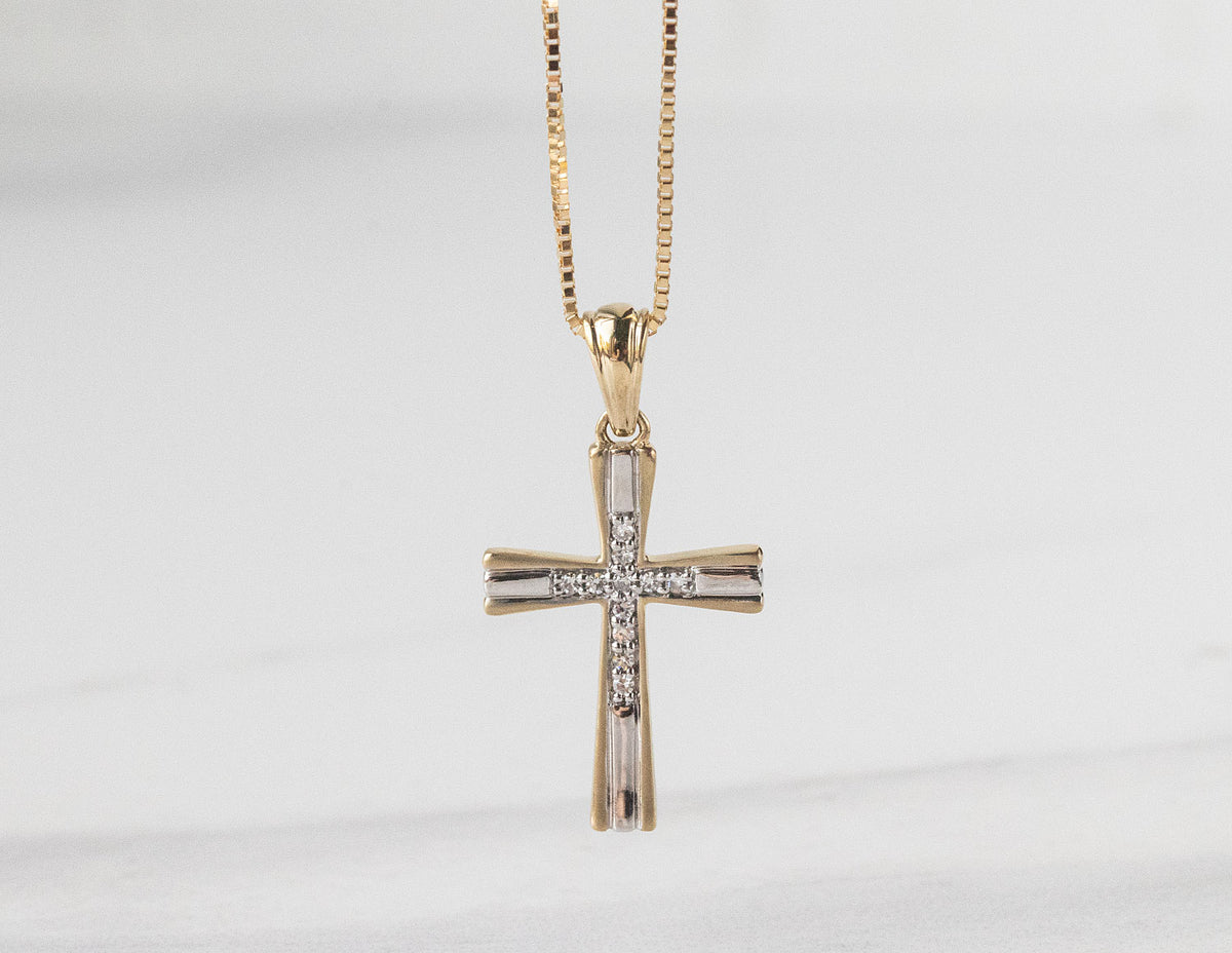 .05ct. t.w. Diamond Cross Pendant in 10K Yellow Gold