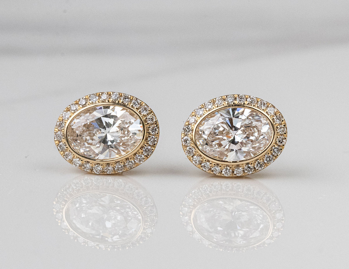 5/8ct. t.w. Oval Cut Newborn Lab Created Diamond Halo Earrings in 14K Yellow Gold