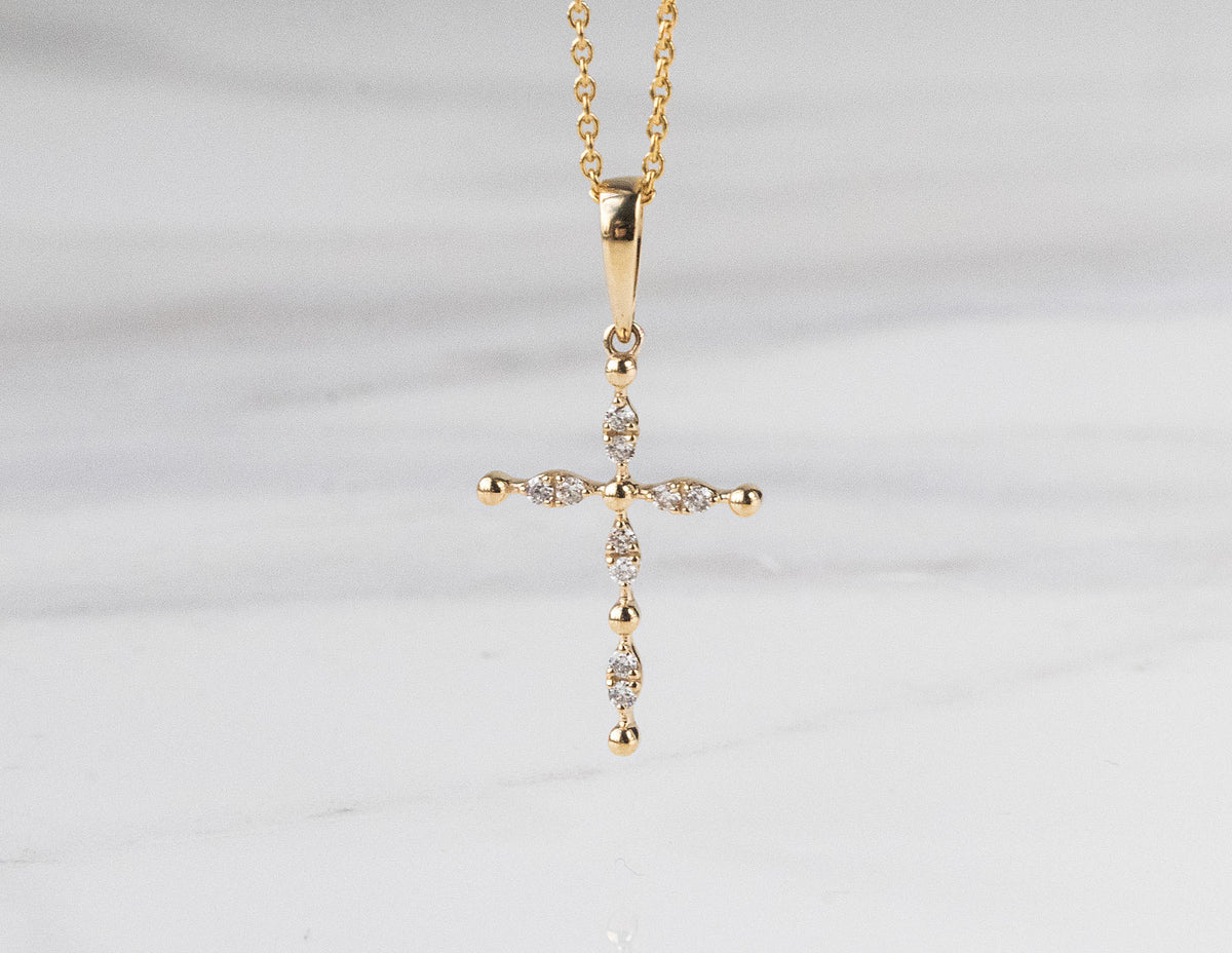 .06ct. t.w. Diamond Cross Pendant in 10K Yellow Gold