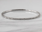 2/5ct. t.w. Round and Baguette Cut Diamond Bangle Bracelet in 14K White Gold