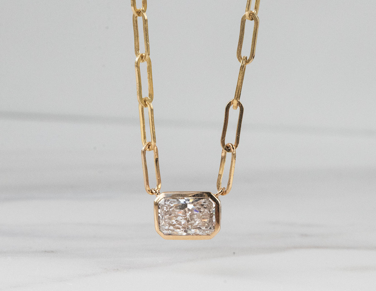 1 1/2ct. Radiant Cut Newborn Lab Created Diamond Bezel Pendant in 14K Yellow Gold