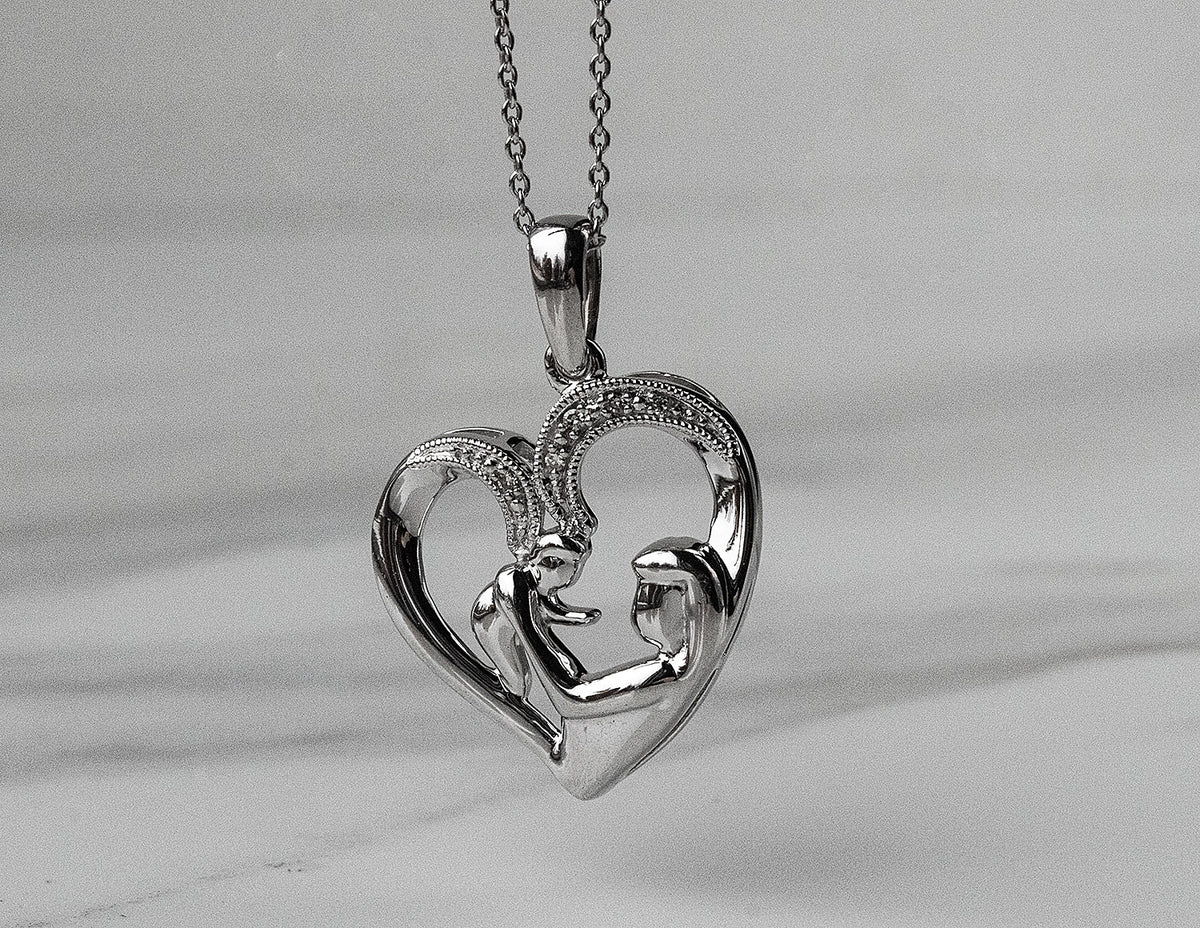.02ct. t.w. Diamond Heart Pendant in Sterling Silver