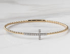 1/3ct. t.w. Diamond Cross Bracelet in 14K Yellow and White Gold