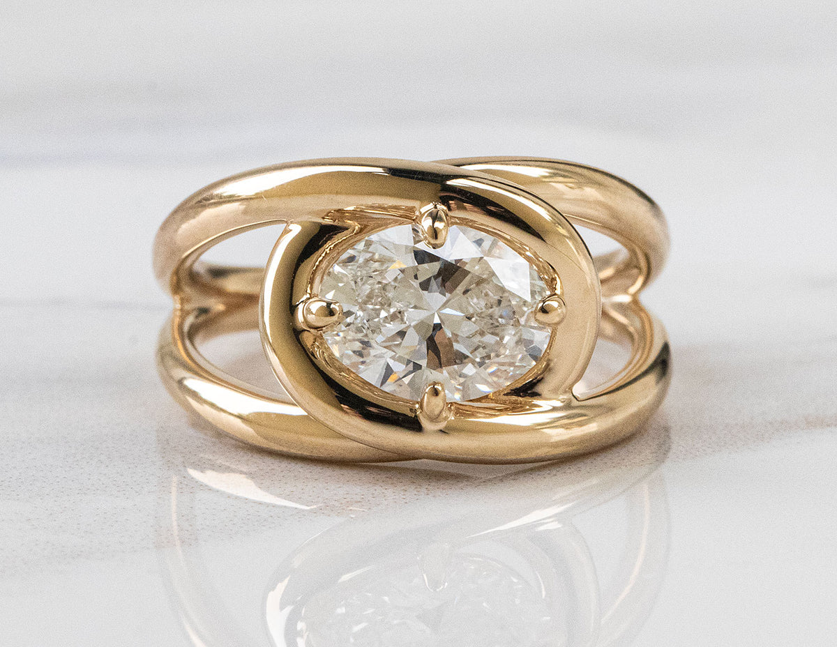 1 1/2ct. Oval Cut Newborn Lab Created Diamond East-West Solitaire Engagement Ring in 14K Yellow Gold