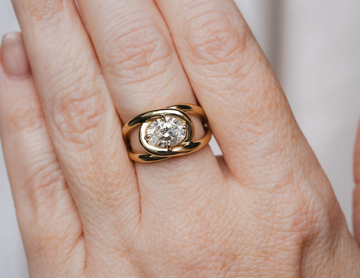 1 1/2ct. Oval Cut Newborn Lab Created Diamond East-West Solitaire Engagement Ring in 14K Yellow Gold