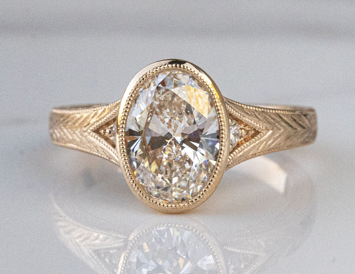 2 1/4ct. t.w. Oval Cut Newborn Lab Created Bezel Diamond Engagement Ring in 14K Yellow Gold