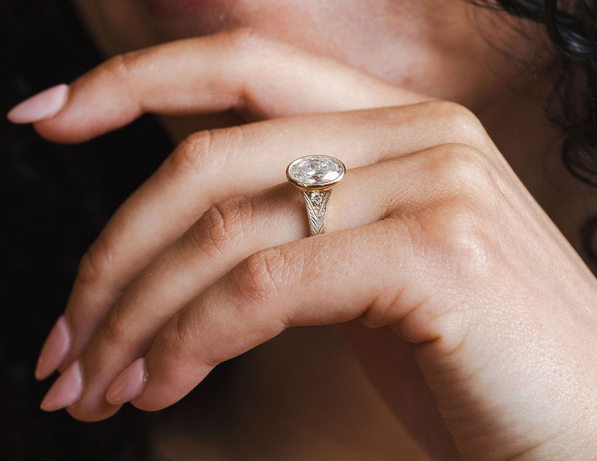 2 1/4ct. t.w. Oval Cut Newborn Lab Created Bezel Diamond Engagement Ring in 14K Yellow Gold