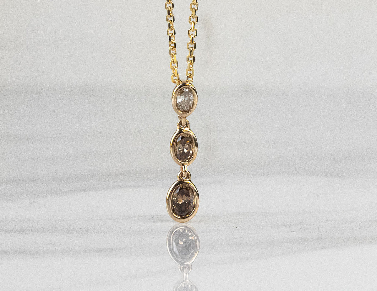 1/3ct. t.w. 3-Stone Brown Oval Cut Diamond Pendant in 14K Yellow Gold