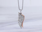 .05ct. t.w. Diamond Angel Wing Pendant in Sterling Silver and 10K Rose Gold