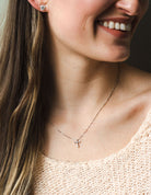 1/10ct. t.w. Diamond Cross Pendant in Sterling Silver