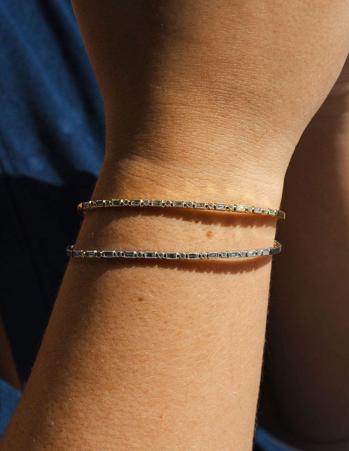 2/5ct. t.w. Round and Baguette Cut Diamond Bangle Bracelet in 14K Yellow Gold