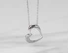 1/10ct. t.w. Diamond Heart Pendant in Sterling Silver