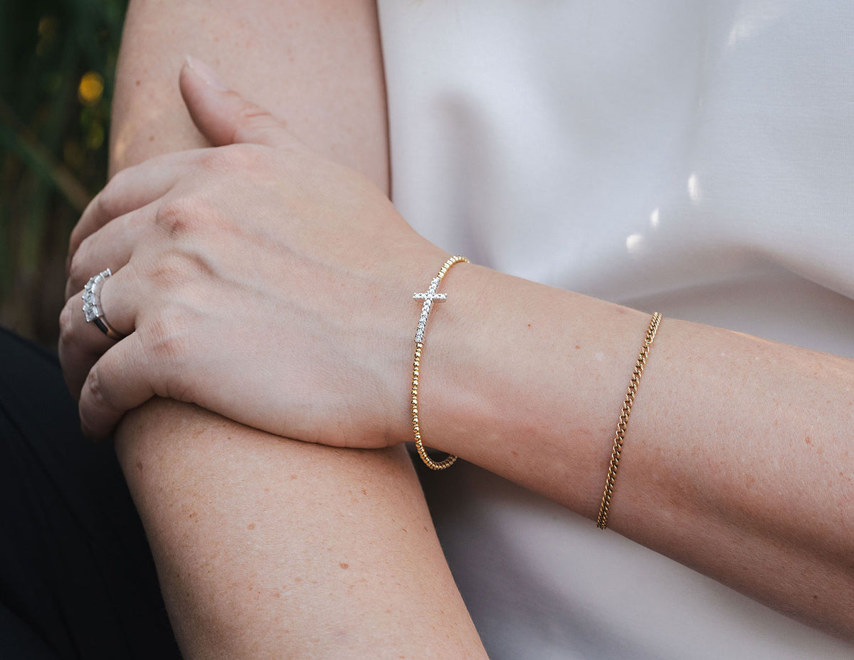 1/3ct. t.w. Diamond Cross Bracelet in 14K Yellow and White Gold