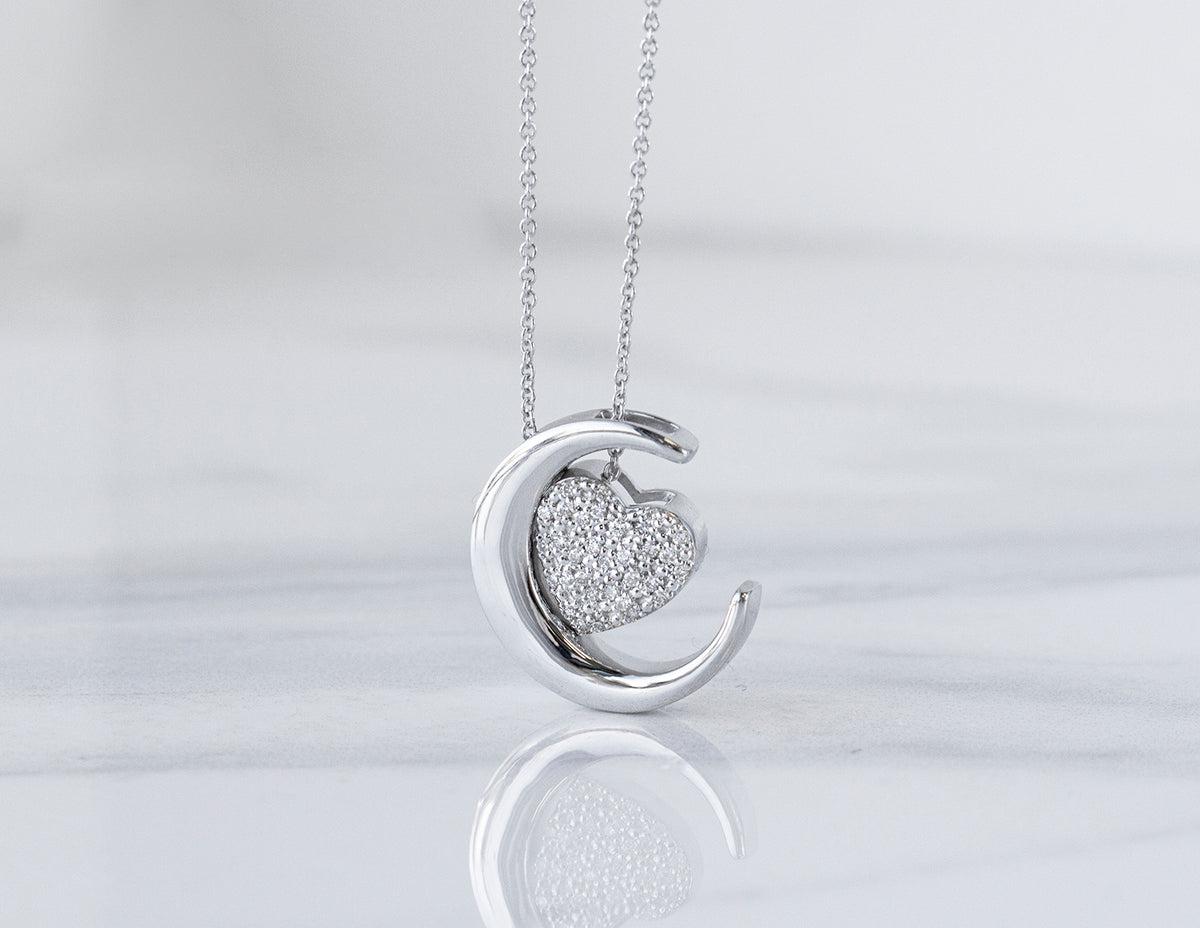 1/8ct. t.w. Diamond 'Love U to the moon & back' Pendant in Sterling Silver