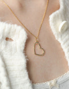 .01ct. Diamond Open Heart Pendant in 14K Yellow Gold