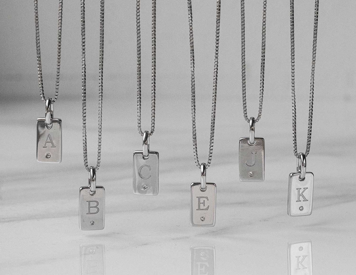 .01ct. Diamond "K" Initial Pendant in Sterling Silver
.01ct. Laser Initial "K" Pendant in Sterling Silver