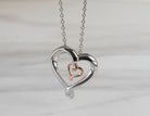 .01ct. Diamond Pendant in Sterling Silver and 10K Rose Gold